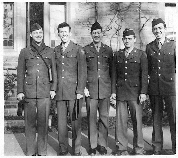 Photograph of Edgar Bowers with his Army Specialized Training Program roommates at 225 Joline Hall, Princeton University, from October to December, 1943.  Pictured from left to right are George F. Cronkite, Edgar Bowers, Sam Pillsbury, Hank Dows, and William Heyl, who is the subject of Bowers's poems "Elegy: for W.C.S.H." and "Late Winter Night," is not pictured.