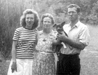 Photograph of Eleanor Bowers, the poet's sister; Grace Bowers, the poet's mother; and Edgar Bowers, holding the dog Smokey; near Stone Mountain, Georgia (December 11, 1947)