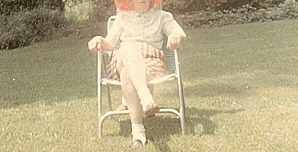 Photograph of Edgar Bowers standing behind his mother, Grace Bowers, in front of the Bowers's house near Stone Mountain, Georgia (July, 1967).